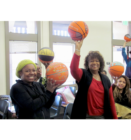 Pyramid project 3, participants showing off the basketballs they decorated