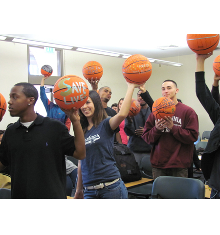 Pyramid project 3, participants showing off the basketballs they decorated