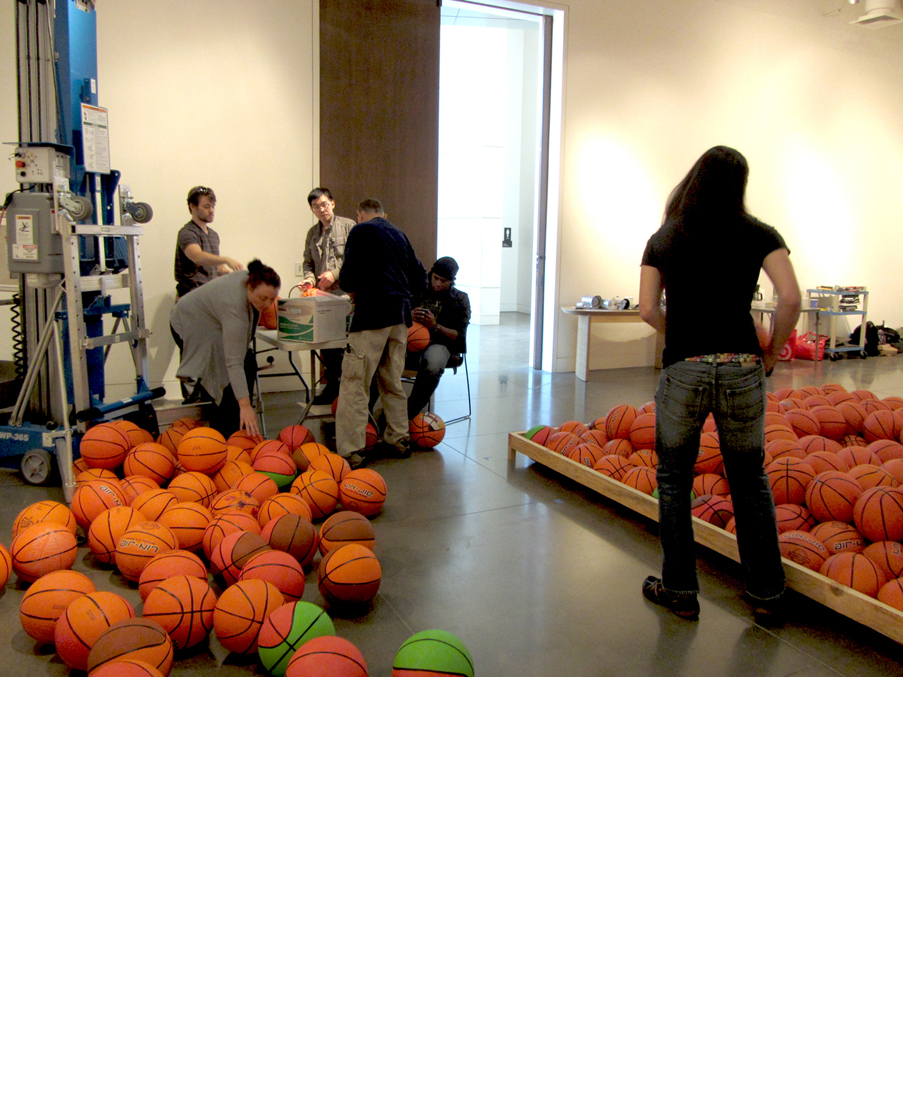Inflating the basketballs for artist David Huffman's project Pyramid 3